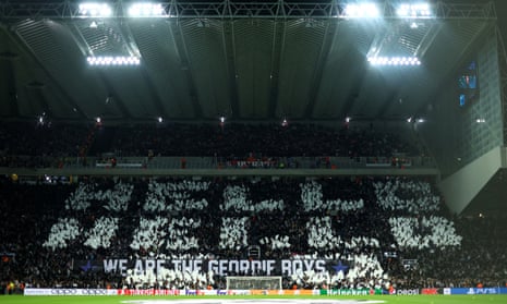 Newcastle United fans display a tifo before the match against PSG.