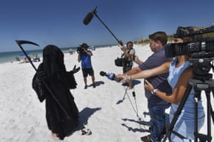 Florida Man Stalks Beach As Grim Reaper To Protest