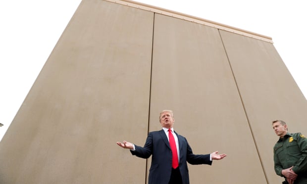 Donald Trump tours US-Mexico border wall prototypes near Otay Mesa port of entry in San Diego, California on 13 March. 