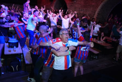 Crystal Palace fans watching at The Steel Yark in London celebrate after Jean-Philippe Mateta scores their side’s first goal during the Europa Conference League final.