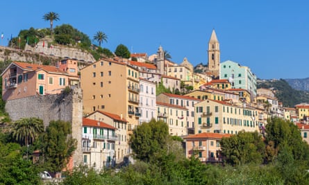 Colorful houses under blue sky in the old town of Ventimiglia, Italy.