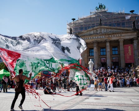 A man waves a giant Palestinian flag in Berlin, Germany, 20 September 2025.