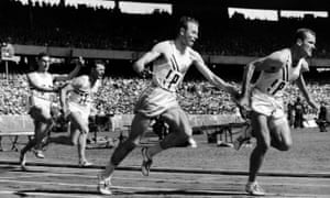 Thane Baker (centre) hands the baton to Bobby Joe Morrow in the first heat of the 4x100 in Melbourne.
