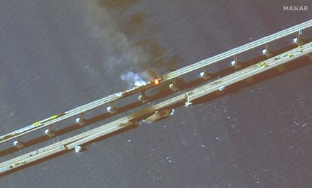 A satellite image provided by Maxar Technologies showing damage to the Kerch bridge.