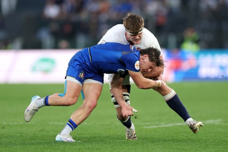 England’s Guy Pepper is tackled by Alessandro Garbisi of Italy.