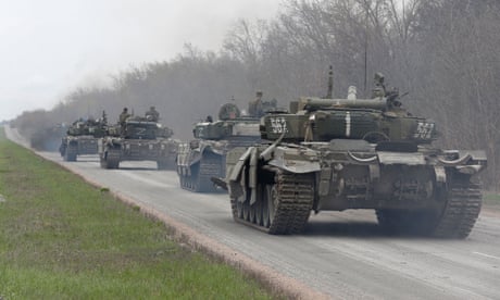 Pro-Russian troops driving tanks near Mariupol in April