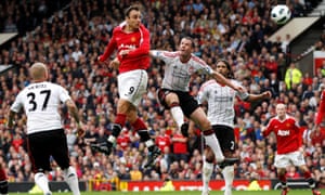 Dimitar Berbatov outjumps Jamie Carragher to complete his hat-trick against Liverpool in 2010.
