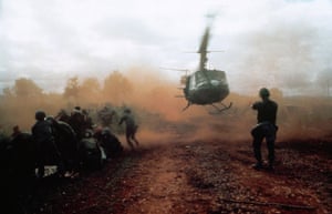A US helicopter takes off from a clearing near Du Co SF camp, Vietnam, 1965