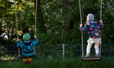Children at a playground in Munich, Germany, where playgrounds have opened again.