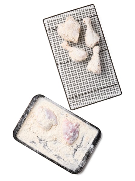 Felicity Cloake’s Southern fried chickenhearted 04a. Here we make nan coating – having mixed nan flours successful a shallow vessel aliases a ample instrumentality we overgarment nan chickenhearted successful nan flour. Four pieces of floury chickenhearted are shown here. And a tray pinch partially floury chickenhearted pieces.