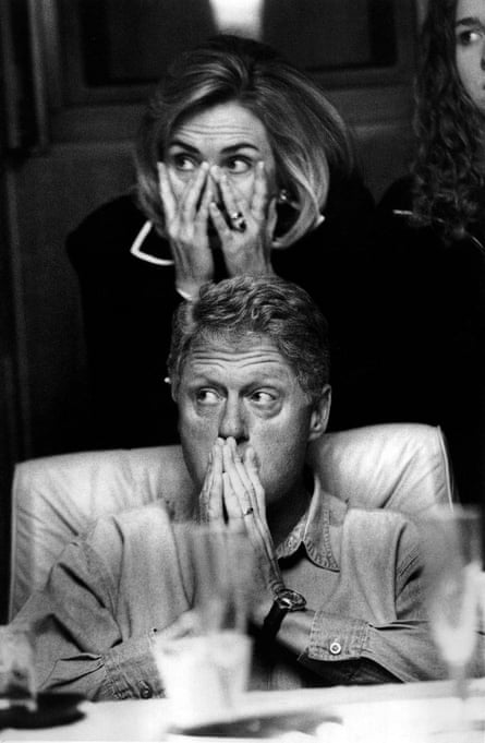 The Clintons listen to a midair briefing in 1996.