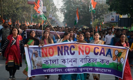 Protesters take part in a rally against India’s new citizenship law in the Indian state of West Bengal on Monday.