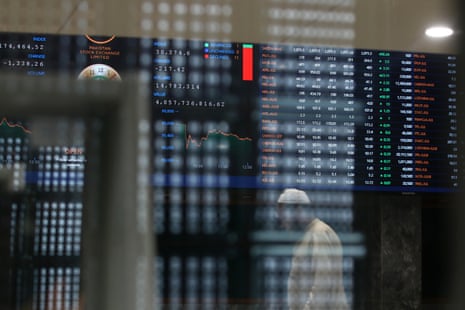 A trader monitors prices at the Pakistan Stock Exchange.