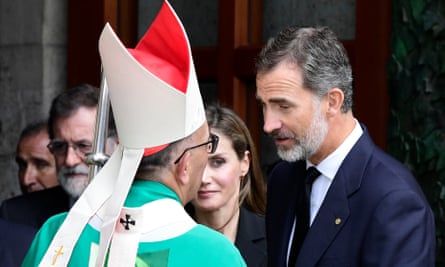 King Felipe (right) and Queen Letizia speak with the archbishop of Barcelona, Cardinal Joan Josep Omella, as they leave after a mass to commemorate victims of the attacks in Barcelona and Cambrils.