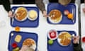Schoolchildren eating a meal.