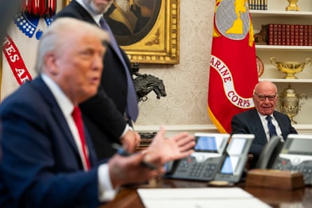 a man speaking at a desk