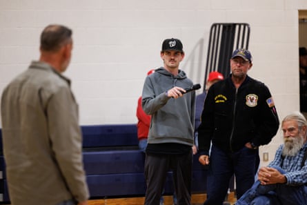 A man asks Dan Osborn a question during a town hall gathering