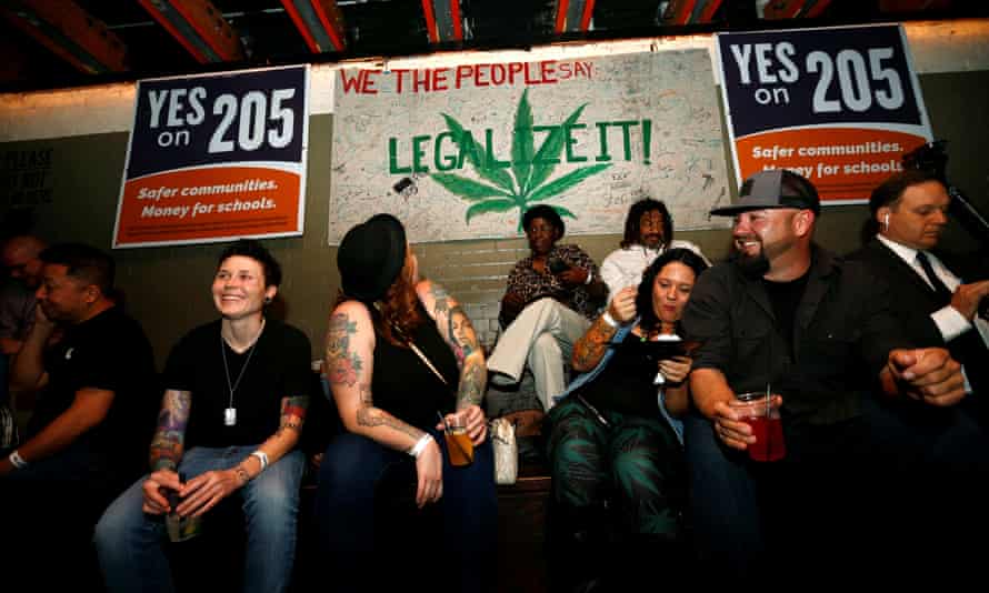 People gather for an election watch party put on by supporters of a legal marijuana initiative in Phoenix, Arizona.