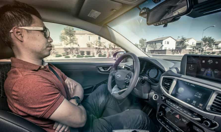 A human behind the wheel of Hyundai’s Ionic driverless car.