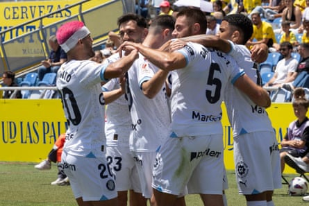 Girona’s players are heading for the Champions League after their 2-0 win at Las Palmas.