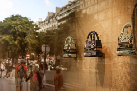 Fancy Christian Dior handbags in a shop window in Paris