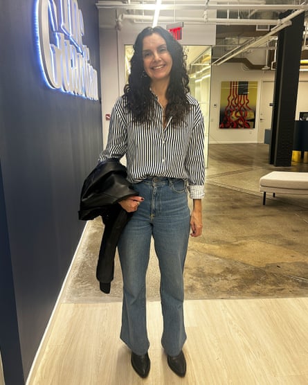 a woman in a striped button down