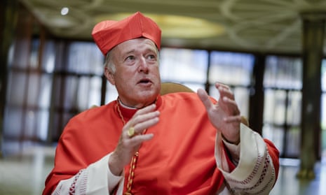 A man wearing a red robe and a cardinal's hat speaks.
