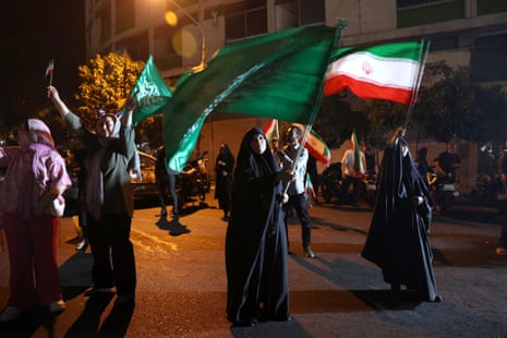 A group of Iranians celebrate following Iran's attack on the U.S. military base in Qatar, amid the Iran-Israel conflict, in Tehran, Iran, June 23, 2025.