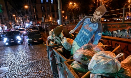 A cardboard cutout of Kvicha Kvaratskhelia is dumped in a bin somewhere in Naples