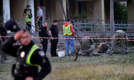 Experts look for fragments of a downed missile in Kyiv