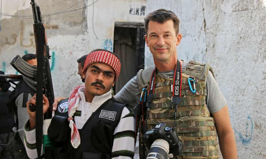 British photojournalist John Cantlie poses with a Free Syrian Army rebel in Aleppo, Syria.