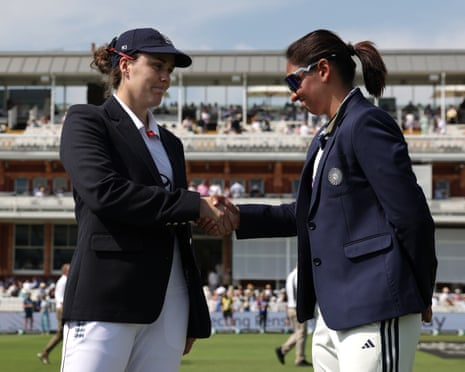 England captain Nat Sciver-Brunt and India captain Harmanpreet Kaur shake hands at the toss on a cricket ground