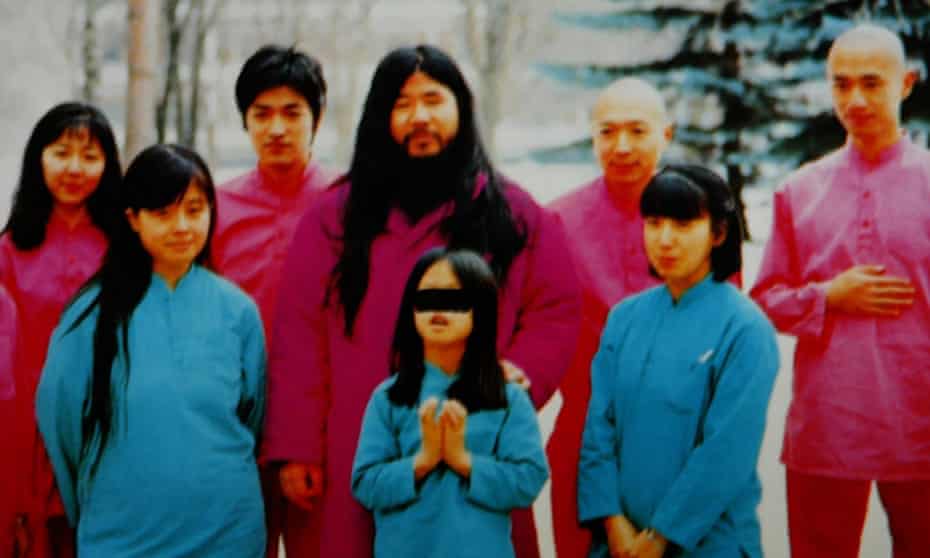 a follower’s picture of Aum leader Shoko Asahara (centre) with family and disciples.