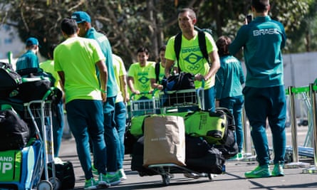 Members of the Brazilian national field hockey team arrive at the Olympic Village on Sunday.
