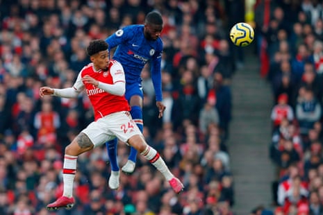 Chelsea defender Fikayo Tomori (R) jumps against Arsenal midfielder Reiss Nelson