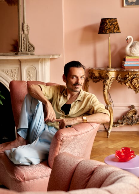 Matthew Williamson sitting on a chair in his ornate living room