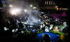 Police face-off with pro-Palestinian students after destroying part of the encampment barricade on the campus of the University of California, Los Angeles early on May 2.