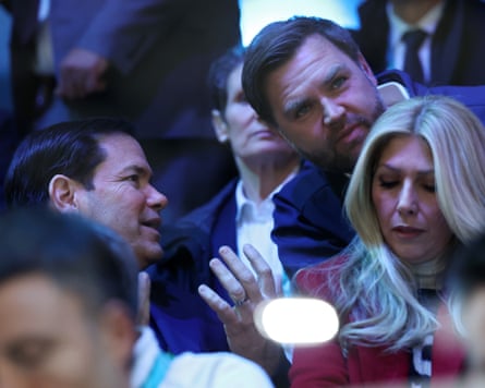 The US secretary of state, Marco Rubio, speaks to the vice-president, JD Vance, in the stands during the ice hockey match between the United States and Czech Republic