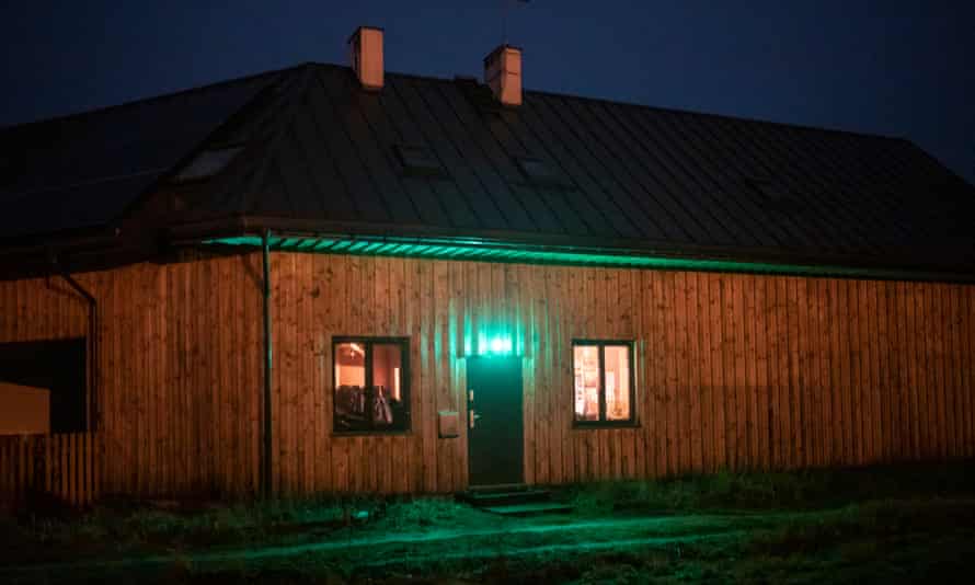 Maria Przyszychowska and her husband Kamil Syller put a green light on their windows to show that their home is a temporary safe space for refugees