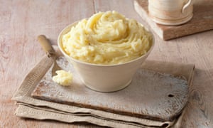 Bowl of mashed potatoes on top of some napkins