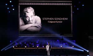 Billy Porter performs during the In Memoriam segment as an image of Stephen Sondheim is shown.