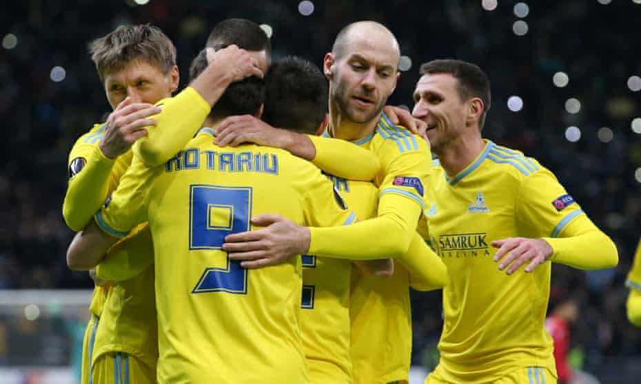 Astana’s Dorin Rotariu celebrates with teammates after his side’s second goal against Manchester United