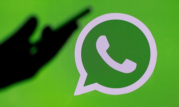 WhatsApp icon next to a silhouette of a phone in a hand