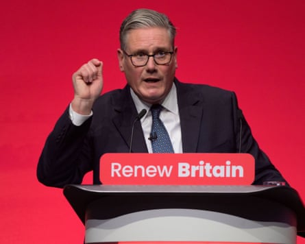 Starmer speaking at a podium with the words "renew Britain" on it