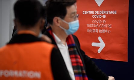 Travellers from China enter the Covid-19 testing centre at Charles de Gaulle airport in Roissy, outside Paris.