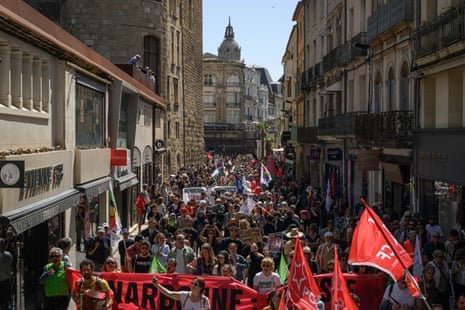 Members of the May 1st Collective march against a meeting of the far-right National Rally political party, on International Workers' Day in Narbonne.
