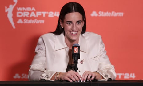 Caitlin Clark speaks at a press conference on Monday night her selection by the Indiana Fever with the No 1 overall pick in the WNBA draft.