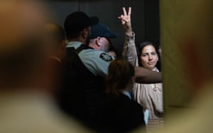 Palestinian protestors are escorted out of the Parliament House car park by Australian federal police and parliamentary security after protesting during question time in the House of Representatives on 18 March.