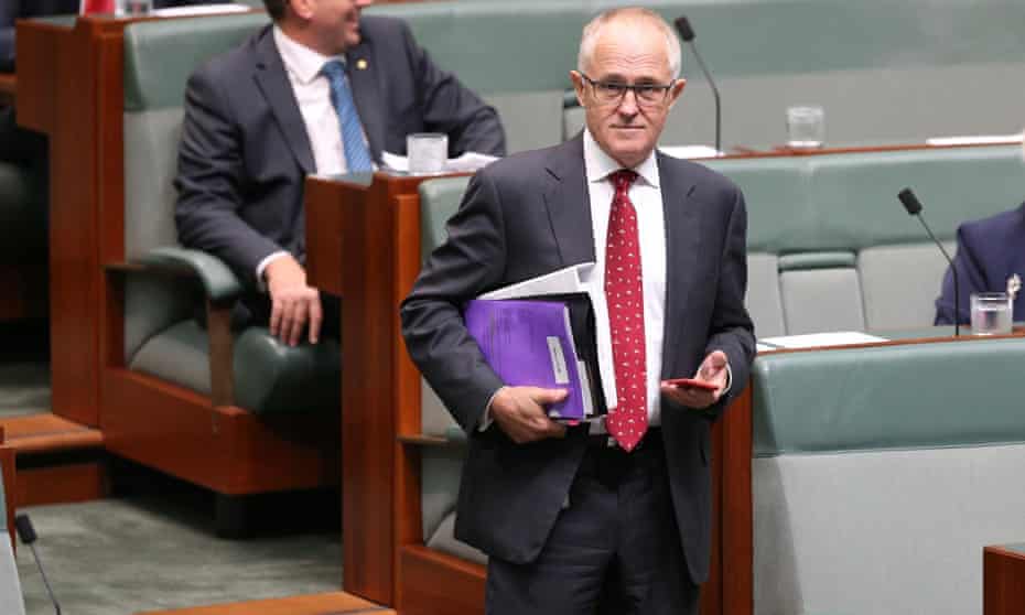 Phone in hand, Malcolm Turnbull arrives for question time in the house of representatives on Wednesday.