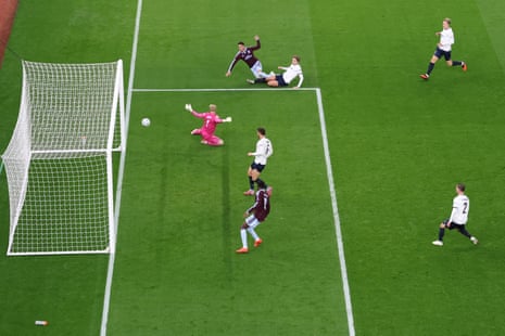A goalkeeper dives as Aston Villa score past Viking’s keeper into the net